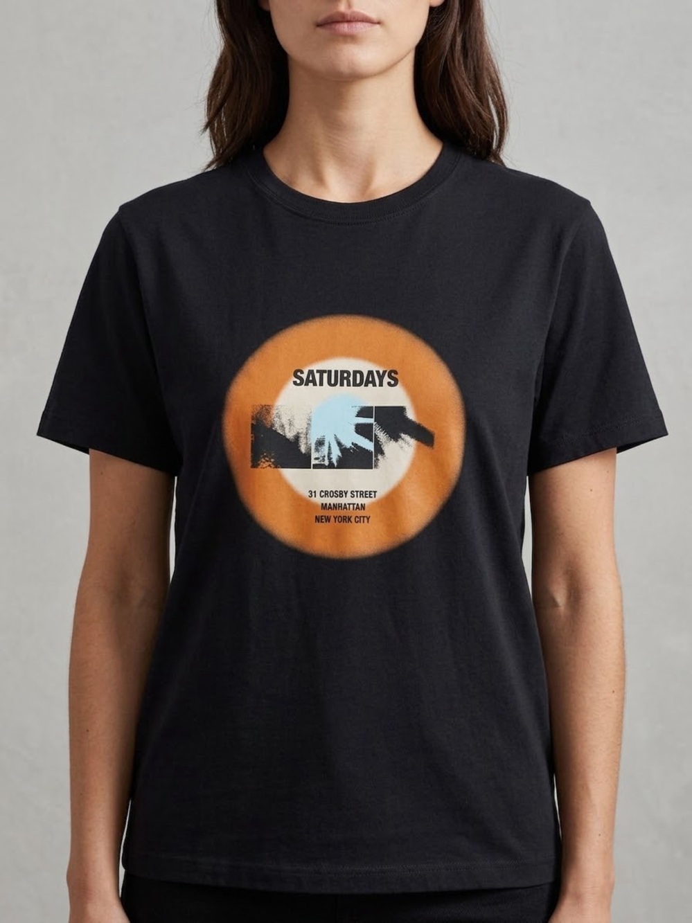 Saturdays New York City Black Tee with Orange Circle Graphic